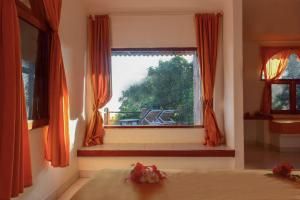 Postel nebo postele na pokoji v ubytování Eva Lanka Hotel - Beach & Wellness