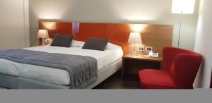 
Een bed of bedden in een kamer bij Hotel Sandalia
