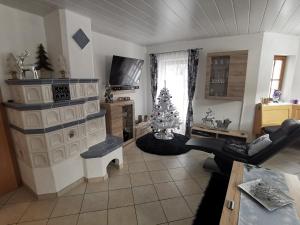 a living room with a christmas tree in it at Alpen-Chalet Ehrwald in Ehrwald