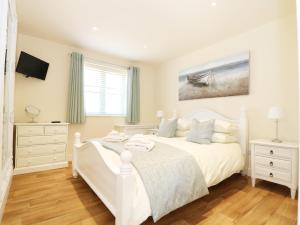 Voodi või voodid majutusasutuse Elm Cottage toas