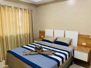 מיטה או מיטות בחדר ב-NatuCenter Hospedaje