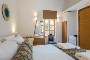 Postel nebo postele na pokoji v ubytování Aelios Design Hotel