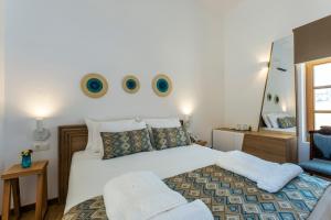 Postel nebo postele na pokoji v ubytování Aelios Design Hotel