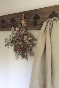 a bunch of dried flowers hanging on a wall at Hoeve Schevey in Mechelen