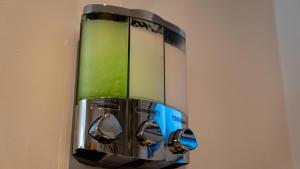 a close up of a blender hanging on a wall at The Duplex with Air Conditioning & Private Deck Area in Margate