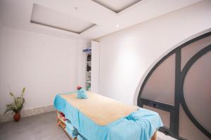 a hospital room with a bed and a mirror at The Sansa Hotel & Spa in Manavgat