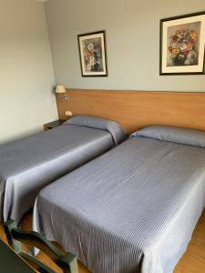 Łóżko lub łóżka w pokoju w obiekcie Hotel Área de Calahorra