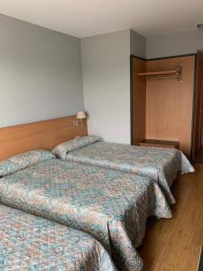 Łóżko lub łóżka w pokoju w obiekcie Hotel Área de Calahorra
