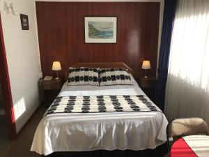 Letto o letti in una camera di Hotel Luanco
