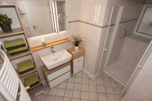 Koupelna v ubytování Ferienwohnungen Vollmers-Dünnebacke + 27 fotografií