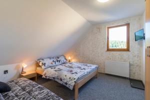Postel nebo postele na pokoji v ubytování Penzion U Krotkých - Vyšší Brod