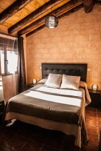 Katil atau katil-katil dalam bilik di Apartamentos Rurales El Casarejo