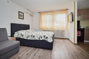 Ein Bett oder Betten in einem Zimmer der Unterkunft Apartmani Vesto