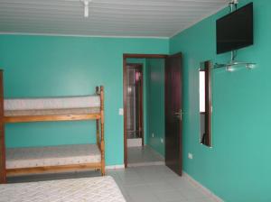 Katil atau katil-katil dalam bilik di Residencial Kinczeski