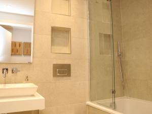 a bathroom with a shower and a sink at Little Fistral in Newquay +19 photos