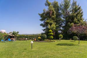 a park with a golf ball in the grass at Villa Katerina in Siviri