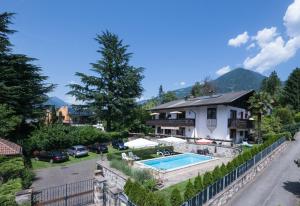 a house with a swimming pool in a yard at Villa Eleonora in Merano