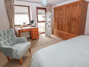 Postel nebo postele na pokoji v ubytování The Old Workshop