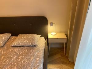 Posteľ alebo postele v izbe v ubytovaní ONE Apartamenty Gąsiorowskich 4