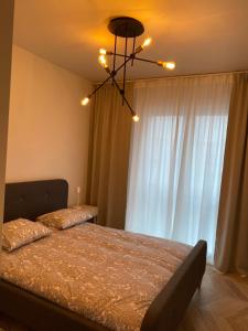 Posteľ alebo postele v izbe v ubytovaní ONE Apartamenty Gąsiorowskich 4