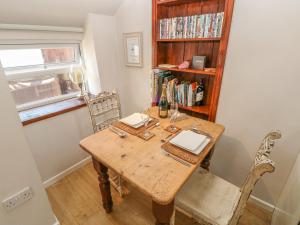 a dining room table with two laptops on it at The Barn at Waunlippa in Narberth