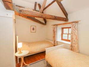 Un pat sau paturi într-o cameră la Mill Farm House