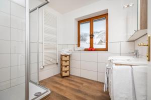 Kúpeľňa v ubytovaní Herzerl-Chalet Appartements