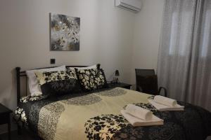 Postel nebo postele na pokoji v ubytování Katsaros - Elegant Home in Nafplio