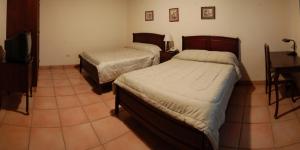 Letto o letti in una camera di Hotel Alsacia