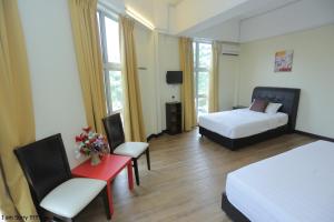 Postel nebo postele na pokoji v ubytování JAM Hotel Kota Warisan Sepang @ ERL Salak Tinggi, KLIA 1-2 & F1