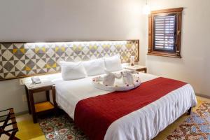 Postel nebo postele na pokoji v ubytování Hotel Caribe Merida Yucatan