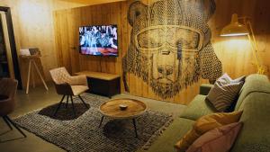 A television and/or entertainment centre at ARLBERGhome Komfort-Apartments & Privat-Sauna