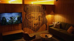 A television and/or entertainment centre at ARLBERGhome Komfort-Apartments & Privat-Sauna