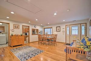 a kitchen and dining room with a table and chairs at Riverfront Elkins Home with Fireplace and Deck! in Elkins +17 photos