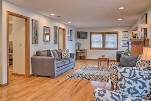 a living room with a couch and a table at Riverfront Elkins Home with Fireplace and Deck! in Elkins