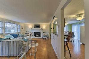 a living room and kitchen with a couch and a table at Pond Access and Private Dock East Wareham Home in East Wareham