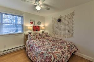 a bedroom with a bed and a ceiling fan at Pond Access and Private Dock East Wareham Home in East Wareham