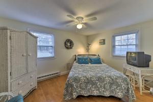 a bedroom with a bed and a ceiling fan at Pond Access and Private Dock East Wareham Home in East Wareham