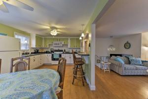 a kitchen and living room with a couch and a table at Pond Access and Private Dock East Wareham Home in East Wareham