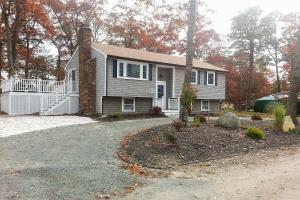 a house with a driveway in front of it at Pond Access and Private Dock East Wareham Home in East Wareham
