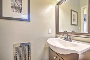a bathroom with a sink and a mirror at Cozy Cabin with Deck and Fireplace in Big Bear! in Big Bear City +16 photos