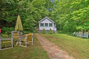 A garden outside Lake Stinson Cottage with Sunroom and Shared Dock!