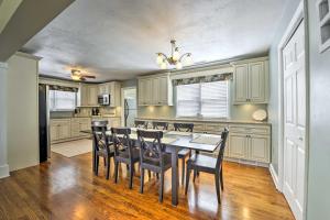 a kitchen with a dining room table and chairs at Breezy Ocean City Home Walk to Beach and Boardwalk! in Ocean City