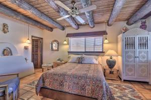 una camera da letto con un letto e un soffitto di Eclectic El Prado Home with Hot Tub Near Downtown! a El Prado