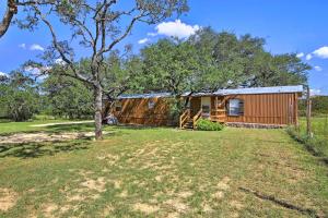 a barn with a yard in front of it at Quiet Utopia Cabin with Deck and Mountain Views! in Utopia