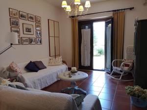 a living room with a couch and a table at B&B L' Eremo in Sulmona