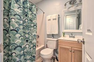 a bathroom with a toilet and a shower curtain at Near Mt Airy Casino Mount Pocono Condo with Balcony in Mount Pocono +16 photos