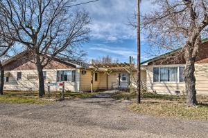 una casa amarilla con árboles delante de ella en HighPlaines Haven - Great Hunting and Fishing!, en Long Lake