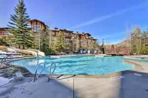 a large swimming pool with snow on the ground at Solitude Creekside Condo-Closest to Ski Lift! in Solitude