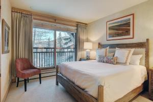 a bedroom with a large bed and a window at Pines TH01 in Beaver Creek